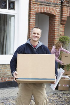 Students packing boxes for a local removals service in New Addington