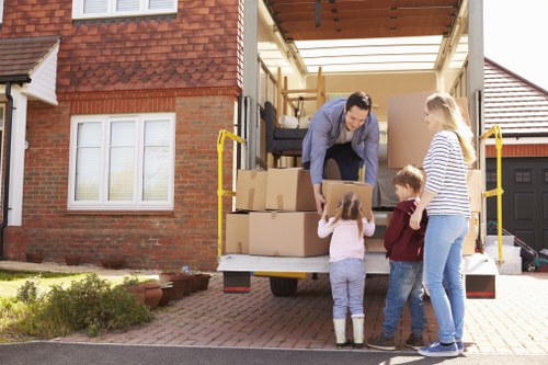 Packed office furniture and moving supplies ready for relocation in New Addington