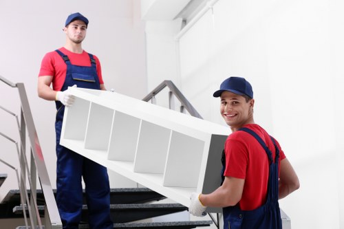 Local moving team handling boxes and furniture near New Addington