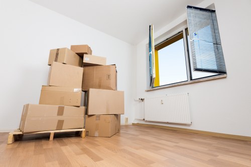 Local removals team handling furniture in New Addington