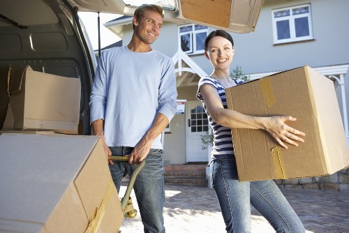 Removals van positioned for a residential flat move in New Addington